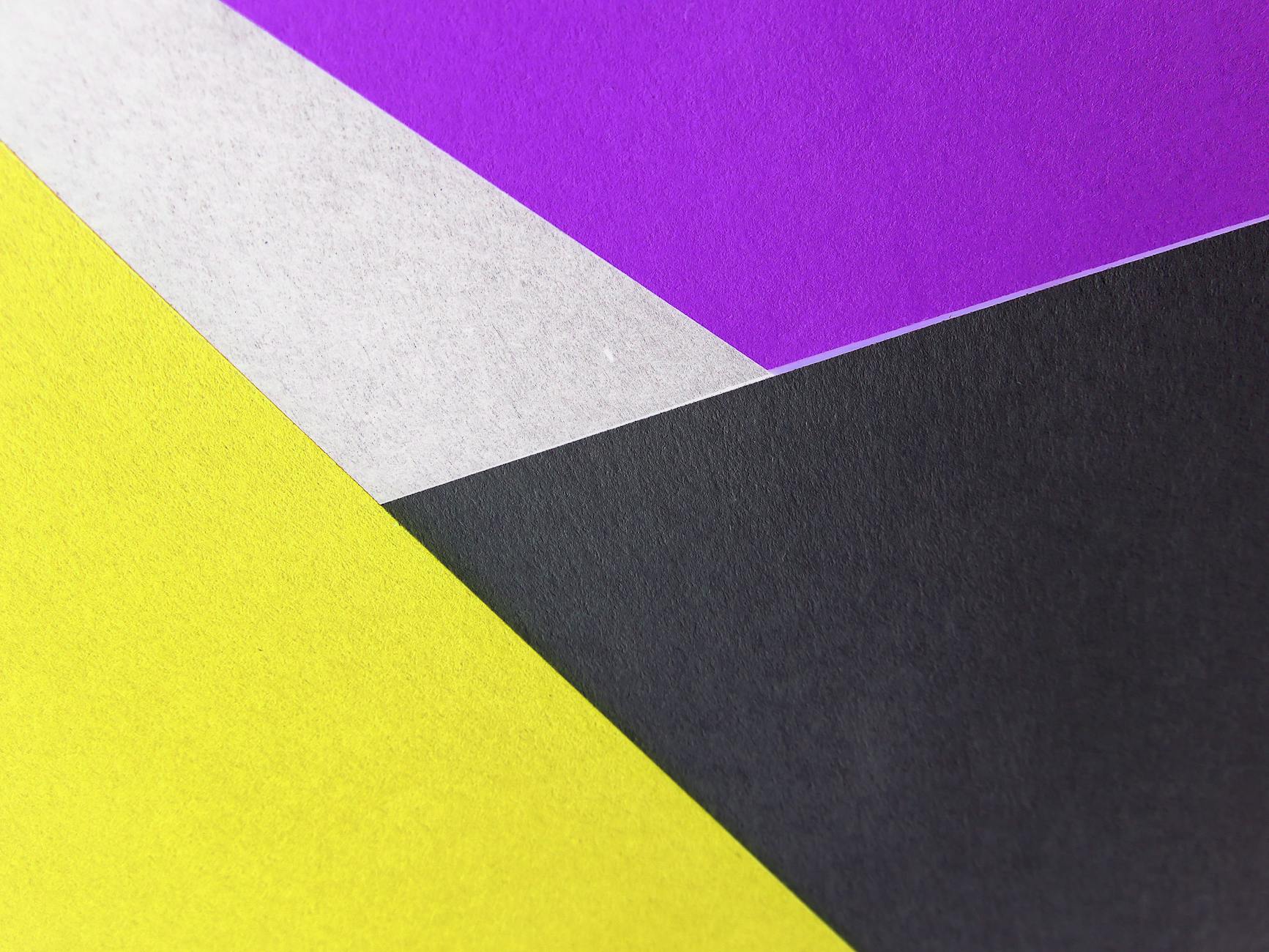 yellow black and purple colored papers
